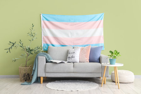 Interior of living room with transgender flag, sofa and tableの写真素材