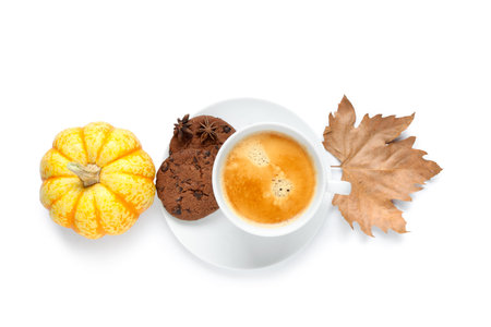 Cup of tasty pumpkin coffee with autumn decorations and cookies isolated on white backgroundの写真素材