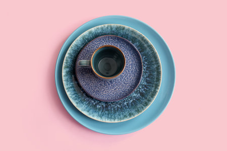 Clean plate, bowl, saucer and cup on pink background. Top viewの写真素材