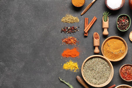 Beautiful composition with fresh aromatic spices on dark backgroundの写真素材
