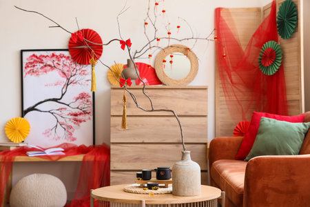 Interior of living room with sofa, table and decor for Chinese New Year celebration