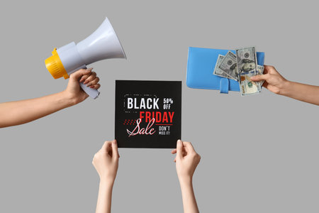 Hands with card, megaphone and money on gray background. Black Friday saleの写真素材
