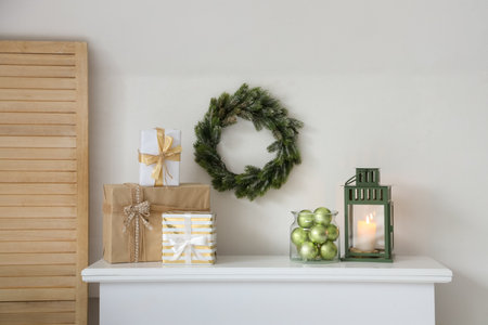 Christmas decorations on fireplace in roomの写真素材