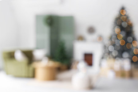 Interior of modern living room with fireplace decorated for Christmas, blurred viewの写真素材