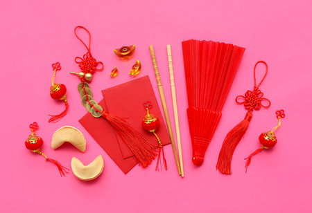 Fortune cookies and Chinese symbols on pink background. New Year celebrationの写真素材
