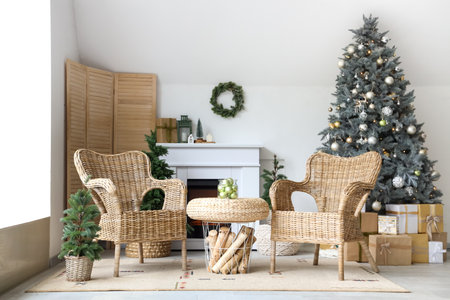 Interior of modern living room with fireplace decorated for Christmasの写真素材