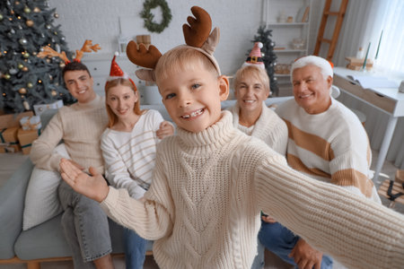 Little boy with his big family taking selfie at home on Christmas Eve, closeupの写真素材
