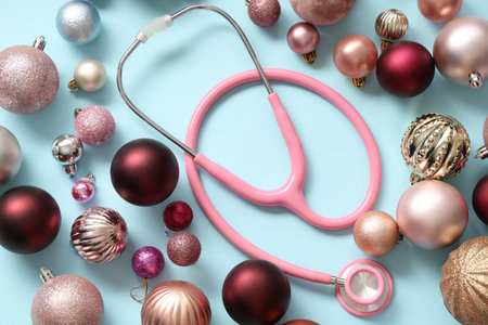Stethoscope with different Christmas balls on blue backgroundの写真素材