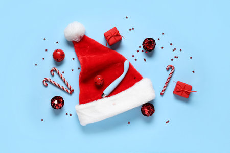 Composition with vibrator, Santa hat and Christmas decorations on color backgroundの写真素材