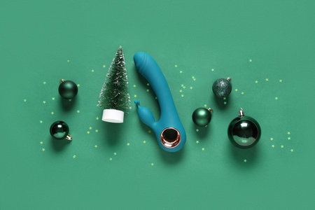 Composition with Christmas decorations and vibrator on color backgroundの写真素材