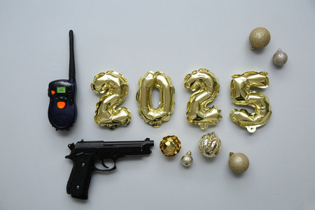 Figure 2025 with police officer's items and Christmas balls on gray backgroundの写真素材