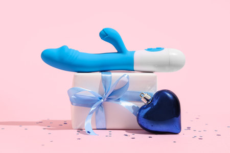Vibrator, Christmas gift and decoration on pink backgroundの写真素材