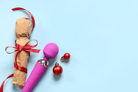 Vibrators and Christmas balls on color backgroundの写真素材