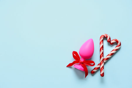 Anal plug and Christmas decorations on color backgroundの写真素材