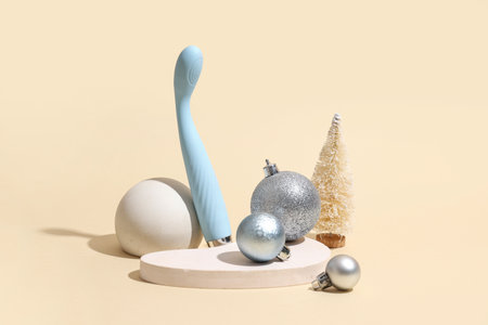 Composition with vibrator, Christmas decorations and plaster decor on color backgroundの写真素材