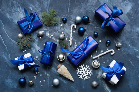 Gifts and Christmas decorations on blue backgroundの写真素材