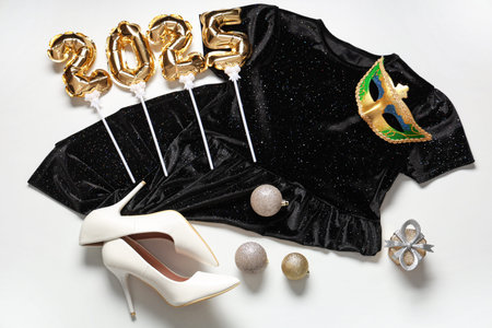 Christmas composition with stylish dress and shoes on white background