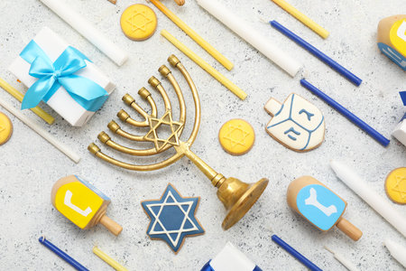 Composition with traditional Hanukkah symbols and gift boxes on grunge white backgroundの写真素材