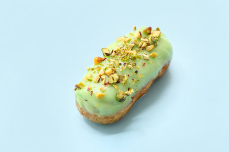 Sweet glazed eclair on color backgroundの写真素材