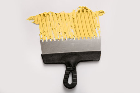Knife with putty on light backgroundの写真素材