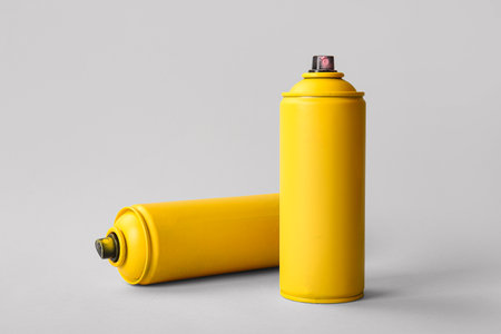 Spray paint cans on white backgroundの写真素材