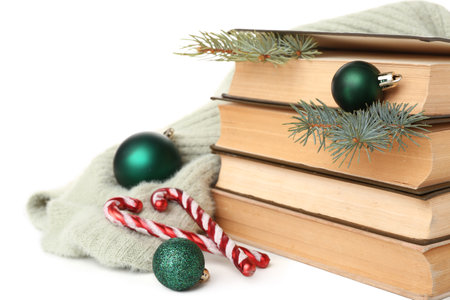 Stack of books, Christmas decorations and clothes isolated on white backgroundの写真素材