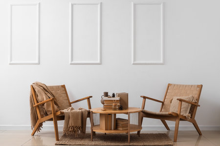 Interior of living room with armchairs and books on tableの写真素材