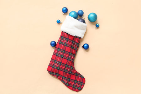 Christmas sock with decorations on beige background. Top viewの写真素材