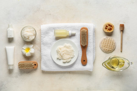 Composition with natural body scrub, cosmetic products and bath supplies on light backgroundの写真素材