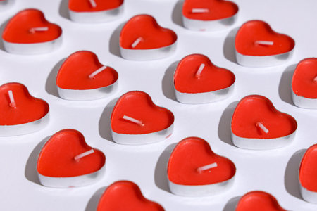 Candles in the shape of heart on gray background. Valentine's Day celebrationの写真素材