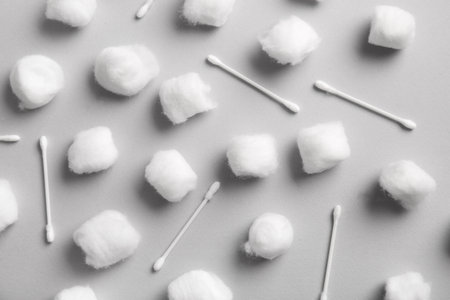 Cotton balls and swabs on gray backgroundの写真素材