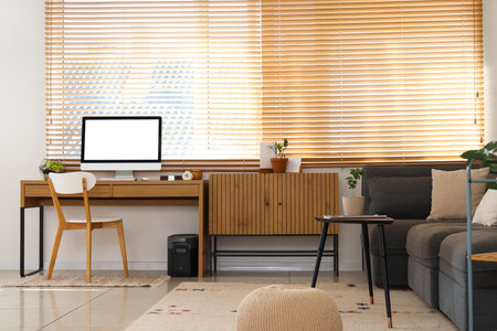 Workplace with computer in interior of living roomの写真素材
