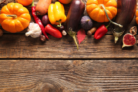 Different fresh vegetables and fruits on wooden background. Harvest festivalの写真素材