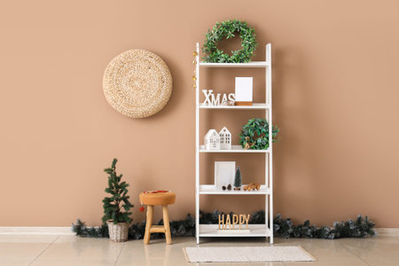 Interior of stylish decorated room with Christmas mistletoe wreath on shelving unitの写真素材