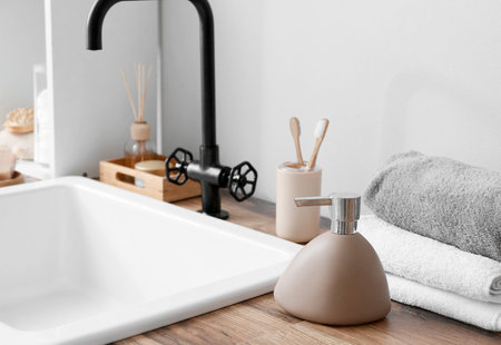 Bath accessories near modern sink in bathroomの写真素材