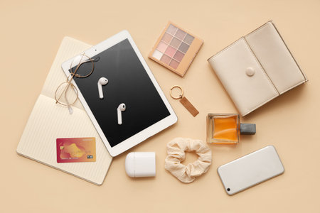 Composition with female accessories, cosmetics and modern gadgets on color background