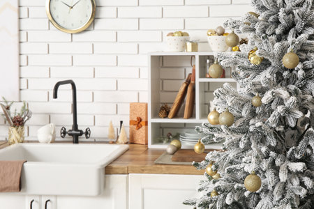 Christmas tree with balls in kitchen, closeupの写真素材