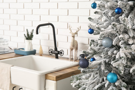 Christmas tree with balls in kitchen, closeupの写真素材