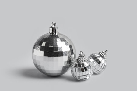 Silver Christmas baubles on gray backgroundの写真素材