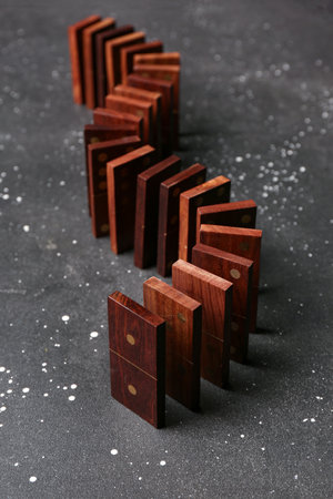 Wooden dominos blocks on black backgroundの写真素材