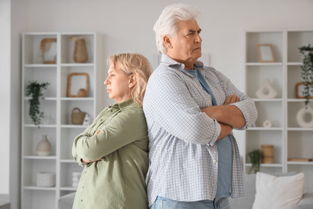 Upset mature couple at home. Divorce conceptの写真素材