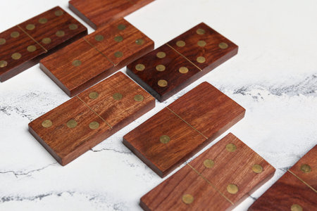 Wooden dominos blocks on marble backgroundの写真素材