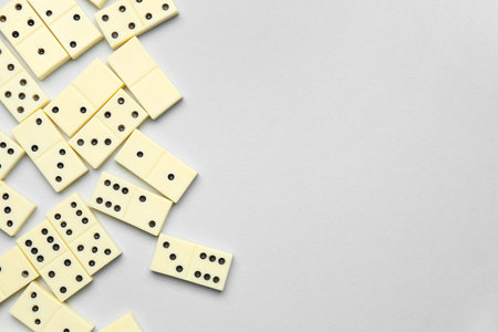 Many white dominos blocks on gray backgroundの写真素材
