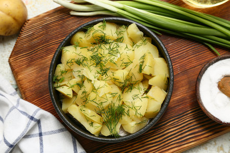 Bowl of tasty potato salad with green onion and salt, closeupの写真素材