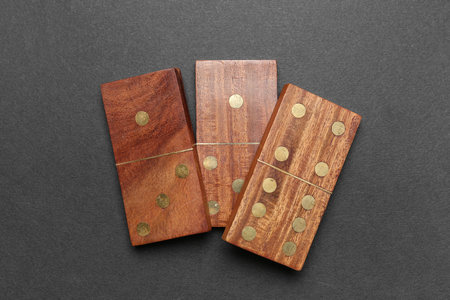 Wooden dominos blocks on black background