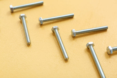 Tap bolts on yellow backgroundの写真素材