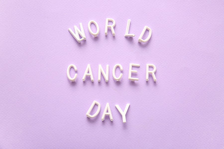 Text WORLD CANCER DAY on lilac backgroundの写真素材
