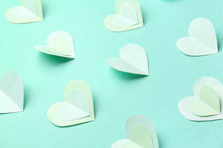 Many paper hearts on turquoise background. Valentine's Day celebrationの写真素材