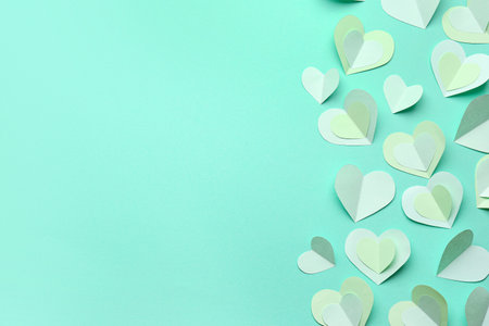 Many paper hearts on turquoise background. Valentine's Day celebrationの写真素材