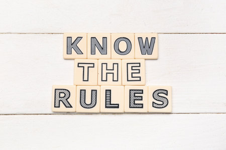 Text KNOW THE RULES on white wooden backgroundの写真素材